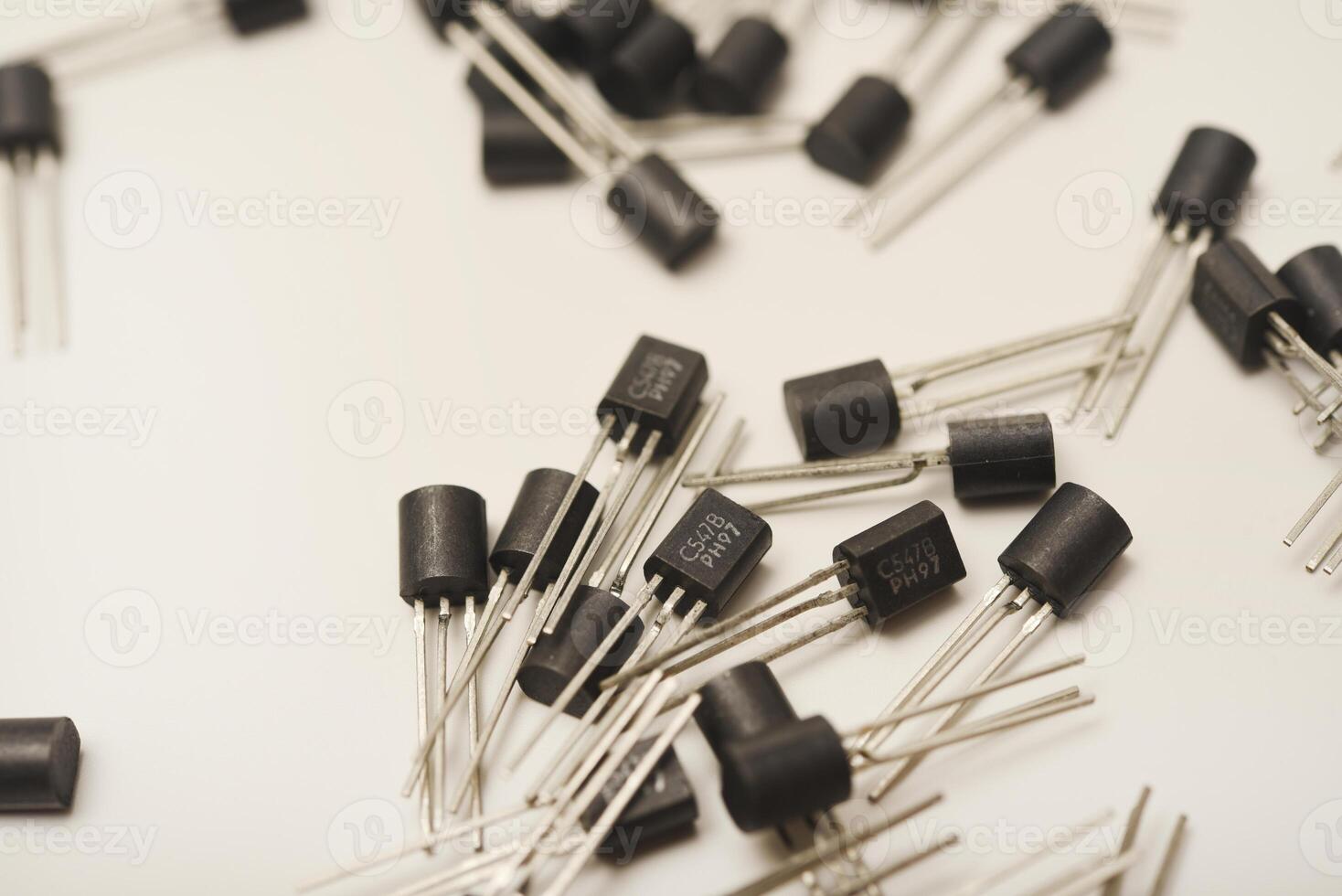 Archaic transistors on a white backdrop. Semiconductor devices. photo