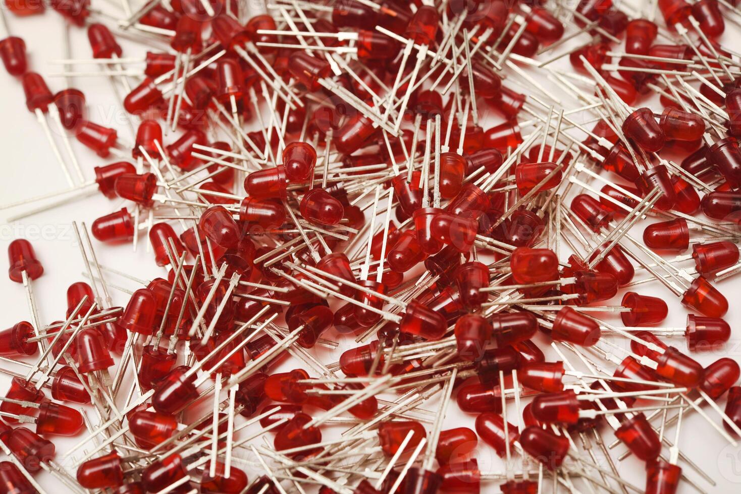 Bright red LED illuminators set on a snowy background. The radio mechanism incorporates an LED-driven bulb. photo