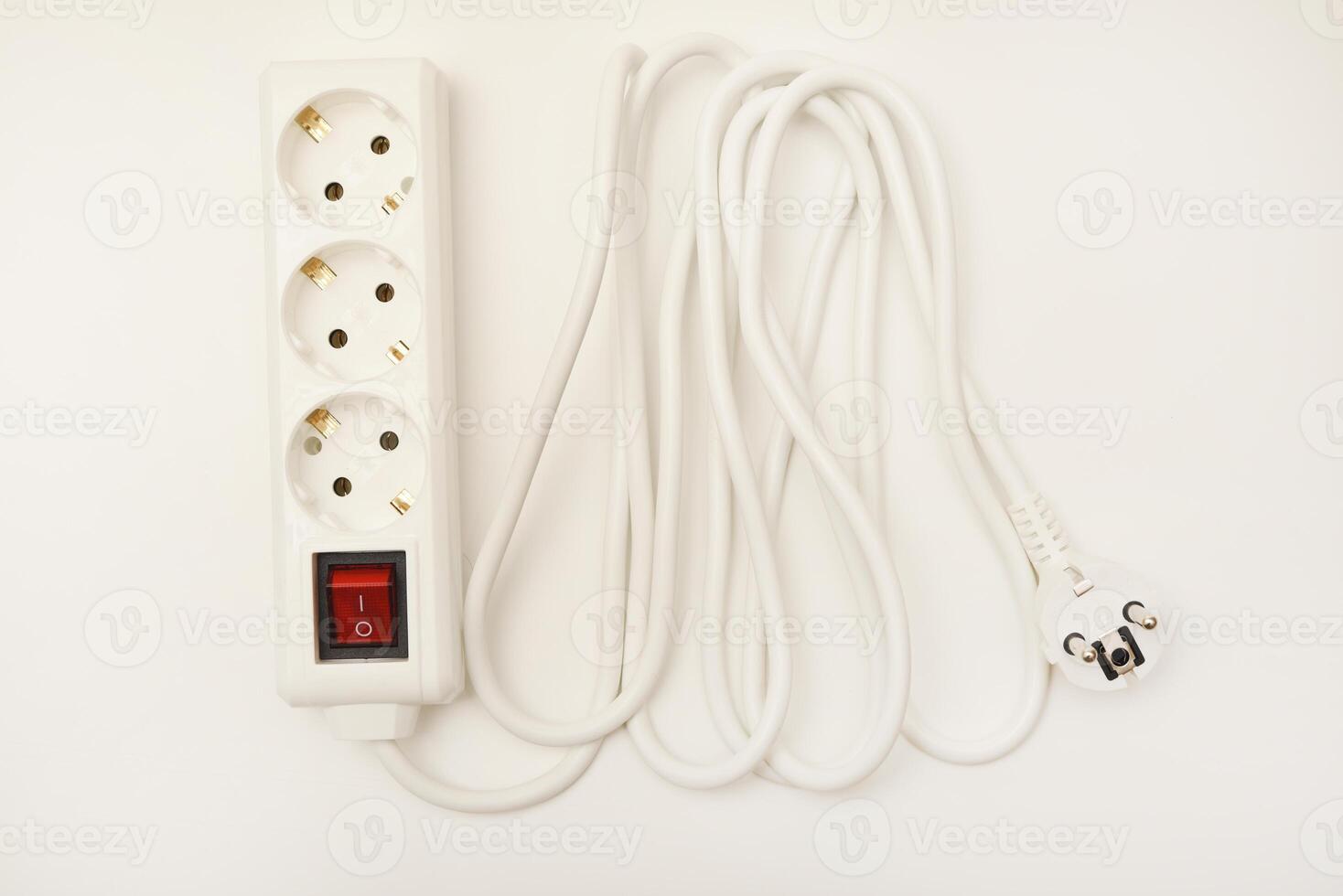 A triple-receptacle extension wire in white, positioned on a pristine white surface. photo