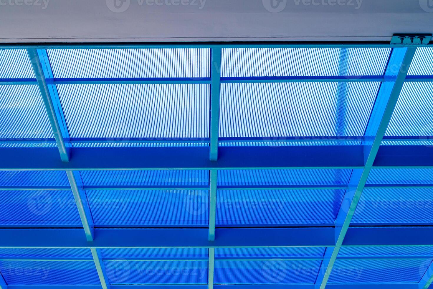 Steel frame and blue polycarbonate plastic roof photo