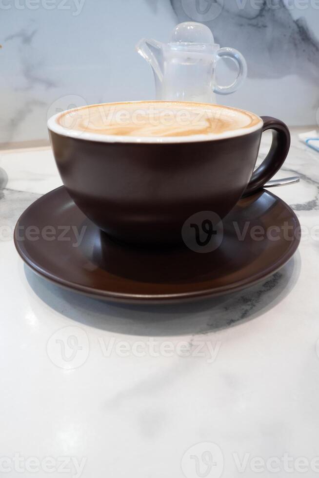 Soft and delicate milk froth in a cup of hot coffee photo