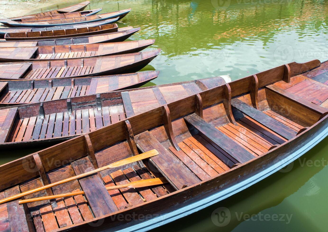 The Wooden boat float in lake photo