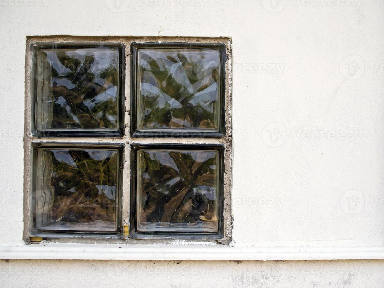 The Glass blocks in the concrete wall photo