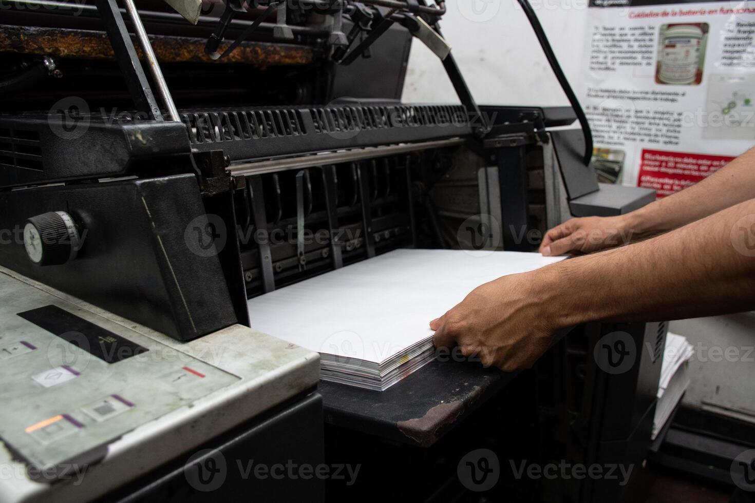Worker Handling Industrial Printer Efficient Printing Production. High quality photo