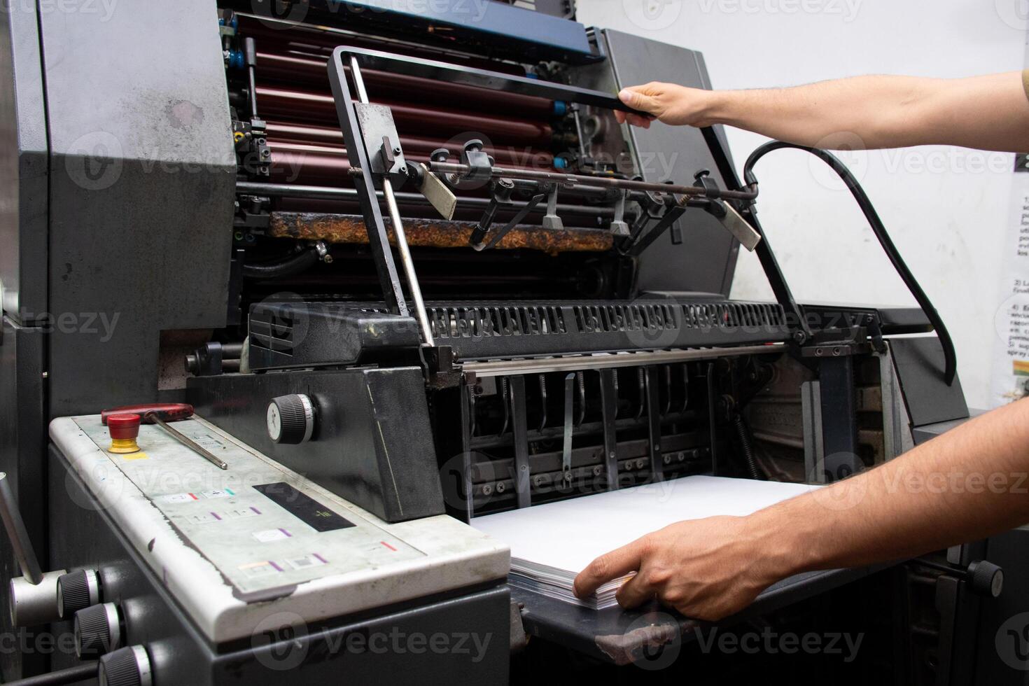 Man Operating Industrial Printer High Performance Printing Process. High quality photo