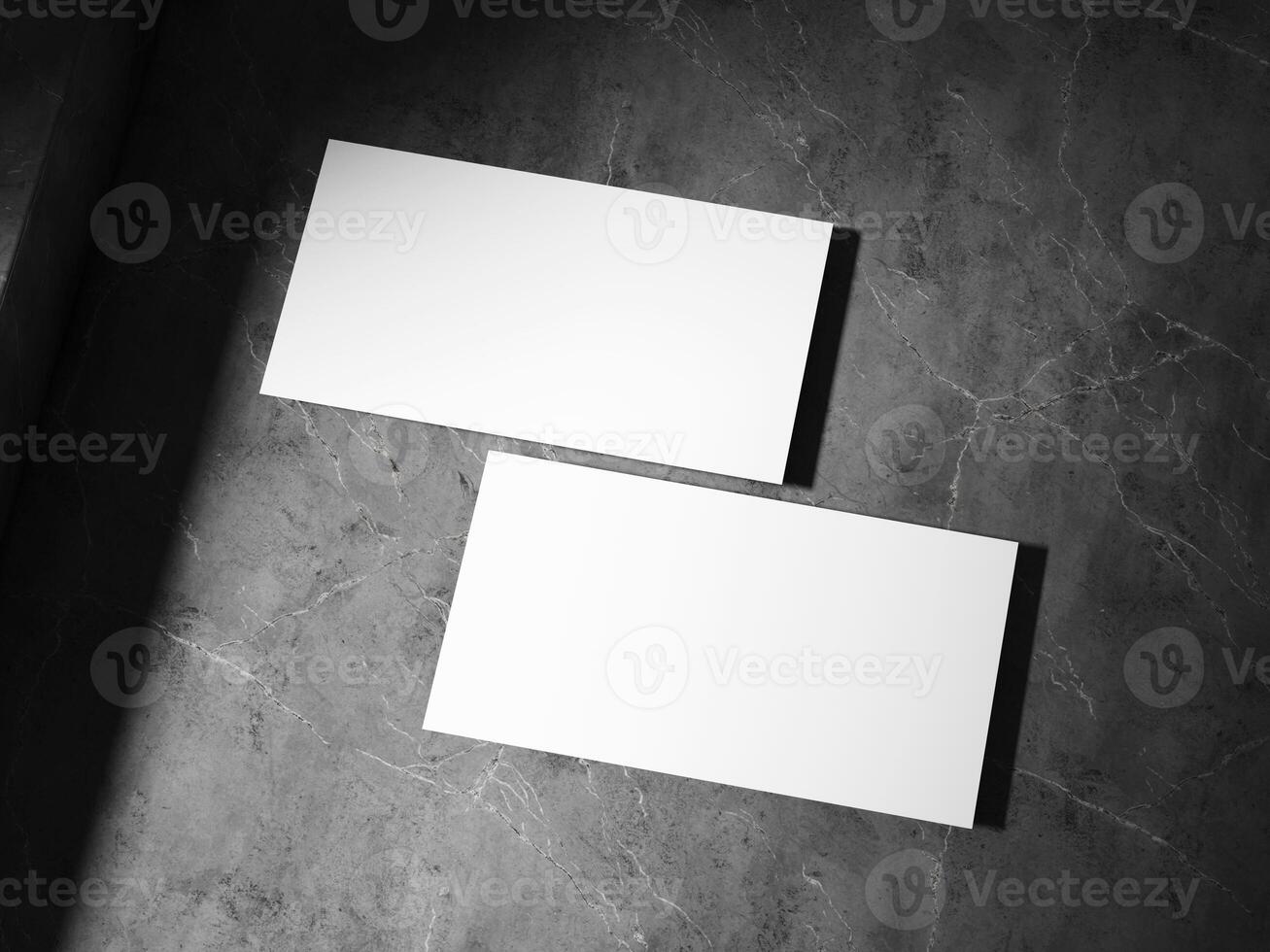 A clean business card placed on a textured stone surface, featuring sharp, well-defined shadows, perfect for a sophisticated brand look. photo