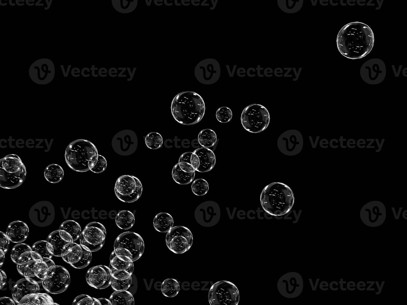 Bubbles floating in the air with a dark background. photo