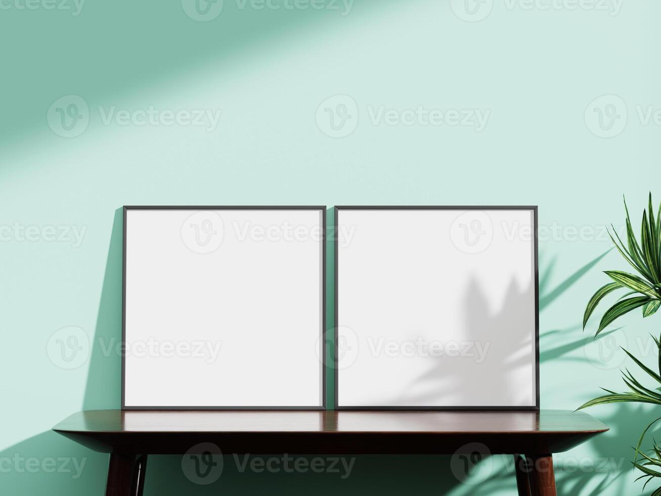 Two elegant black frame mockups side by side on a mint green wall, with a wooden candle holder and a plant, perfect for artistic presentations. photo