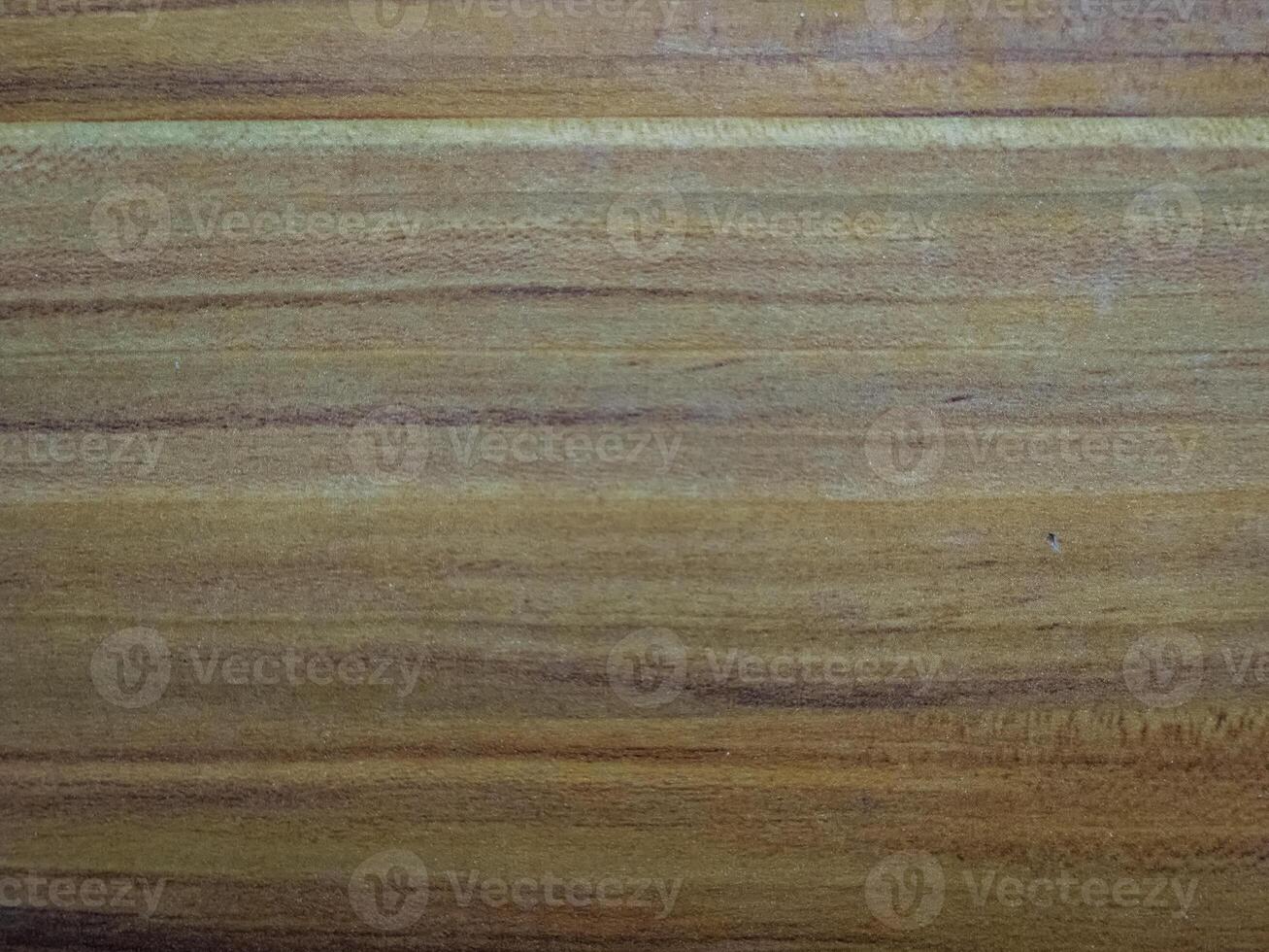 Smooth wooden surface with natural grain patterns, showcasing warm brown tones. photo