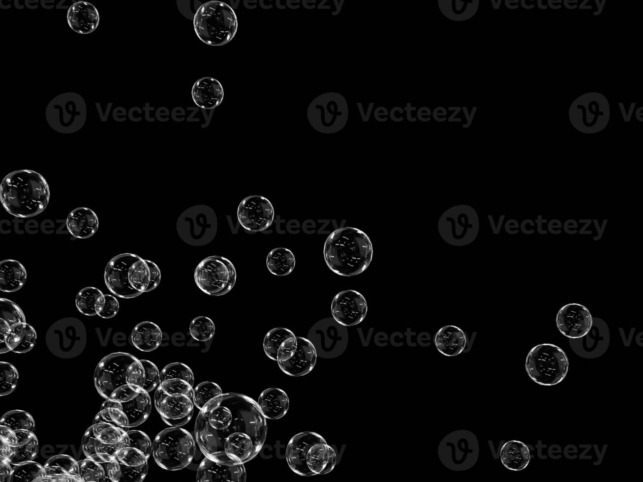 Collection of transparent bubbles scattered against a black background. photo