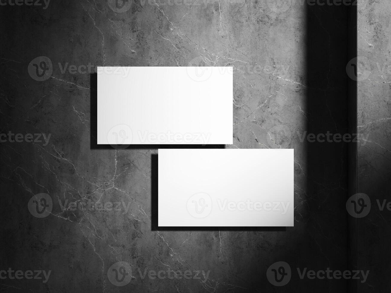 A high-quality mockup showing a business card in a modern, minimalistic style, with contrasting light and shadow on a stone background for a professional touch. photo