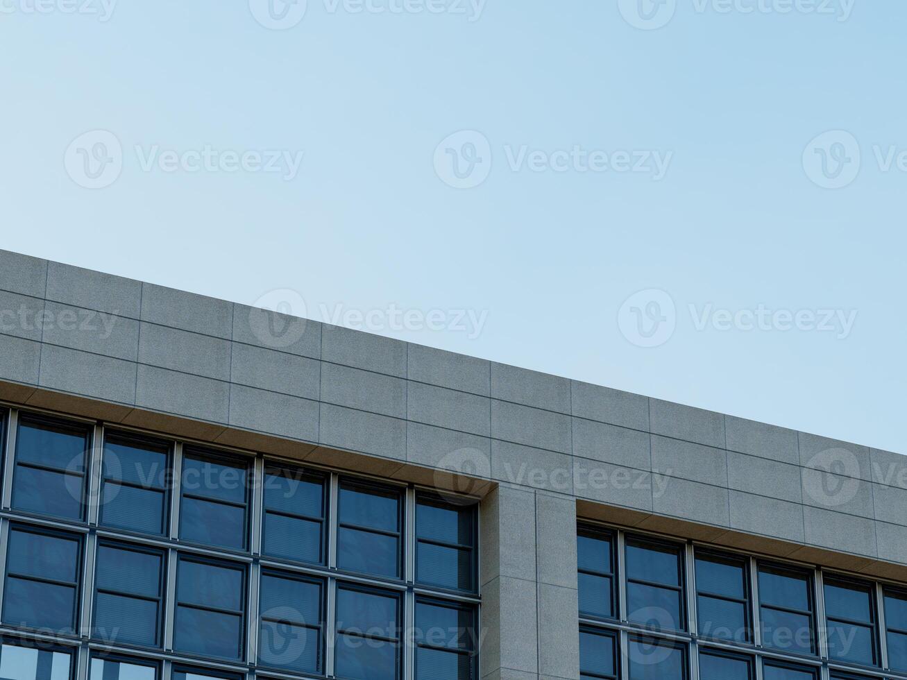 moderno Alto edificio esquina con un claro vaso fachada y azul cielo. foto