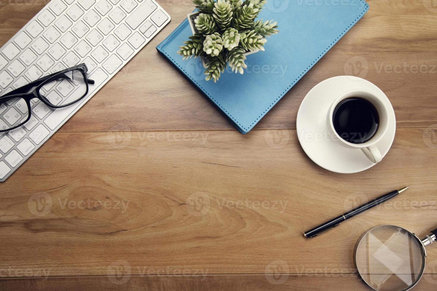 keyboard with notebook with coffee photo