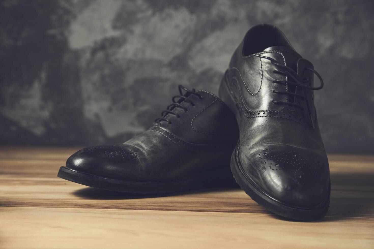 man black shoes on grey background photo