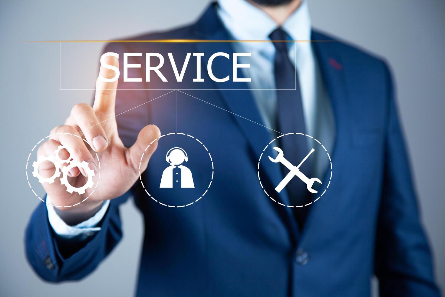 Businessman in suit touching service icon on screen photo