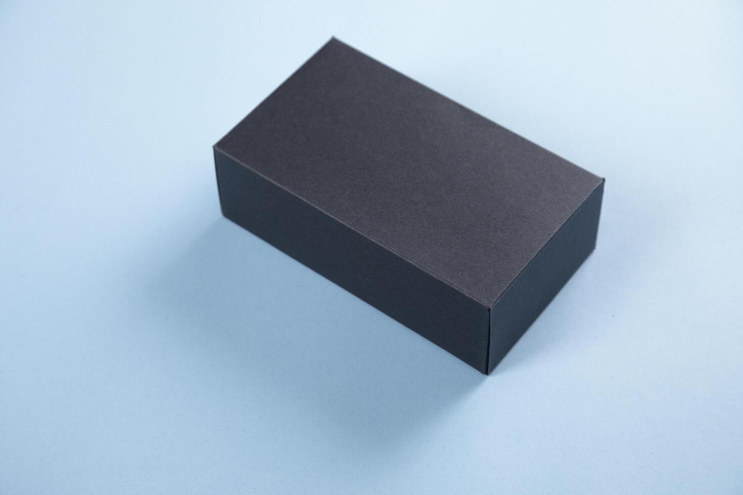 Black box on blue background photo