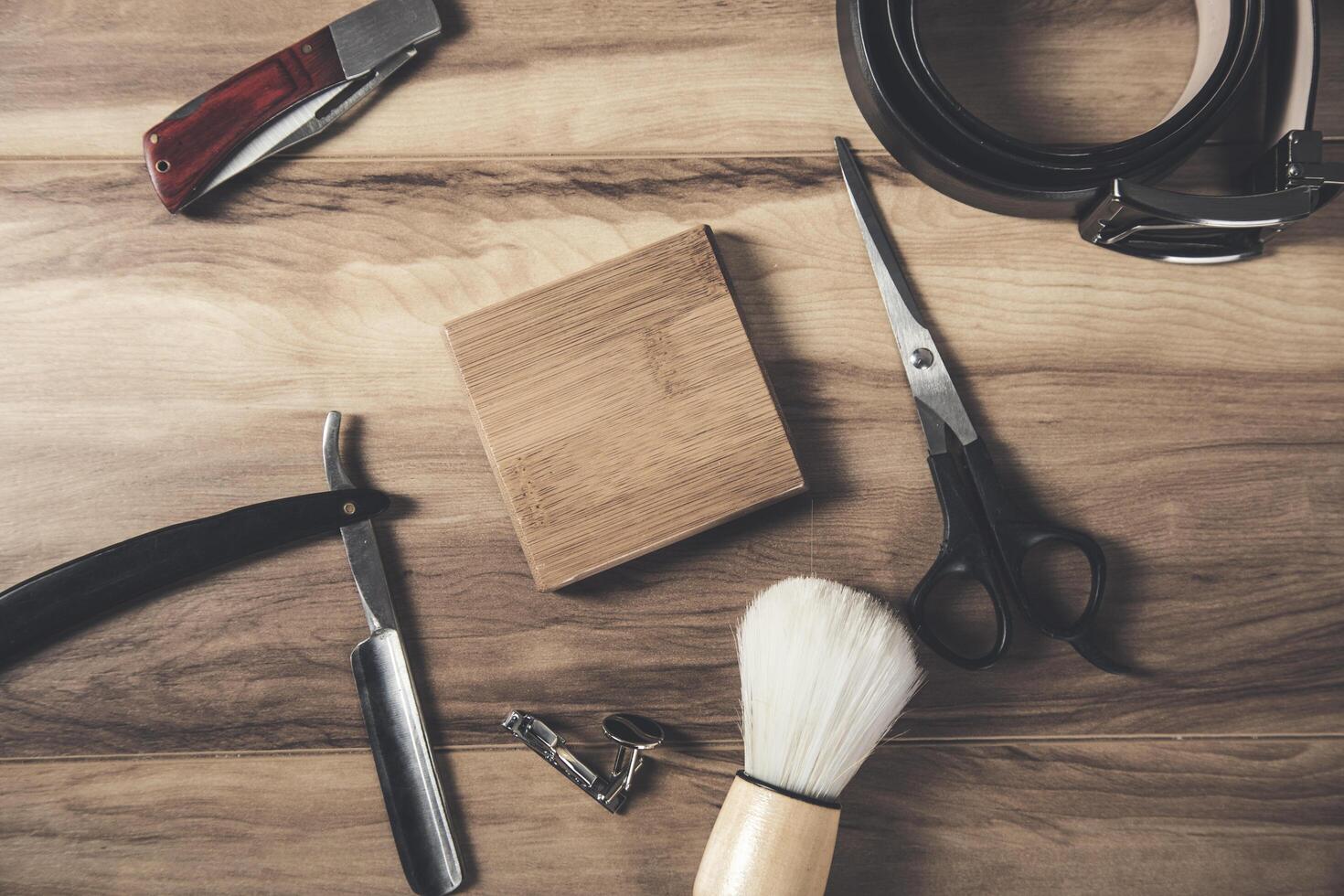 Various tools and accessories on a wooden table photo