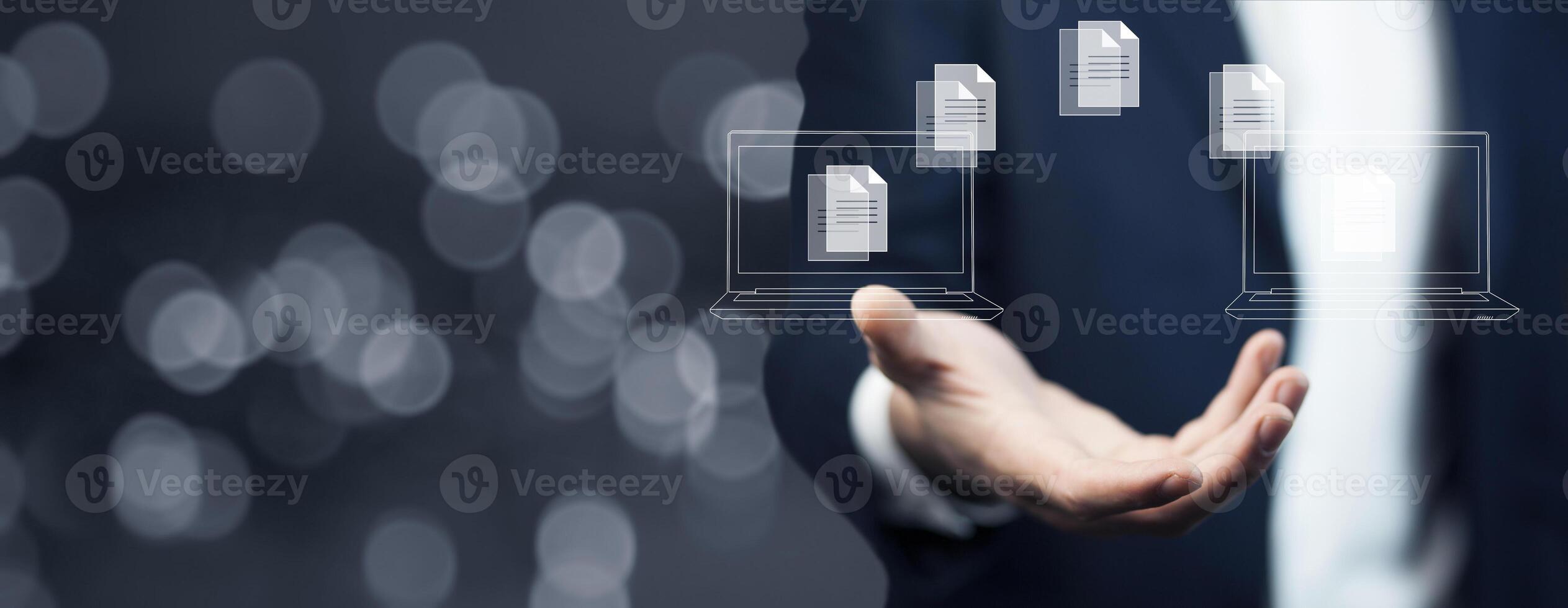 Businessman holding a laptop with a cloud icon on it photo