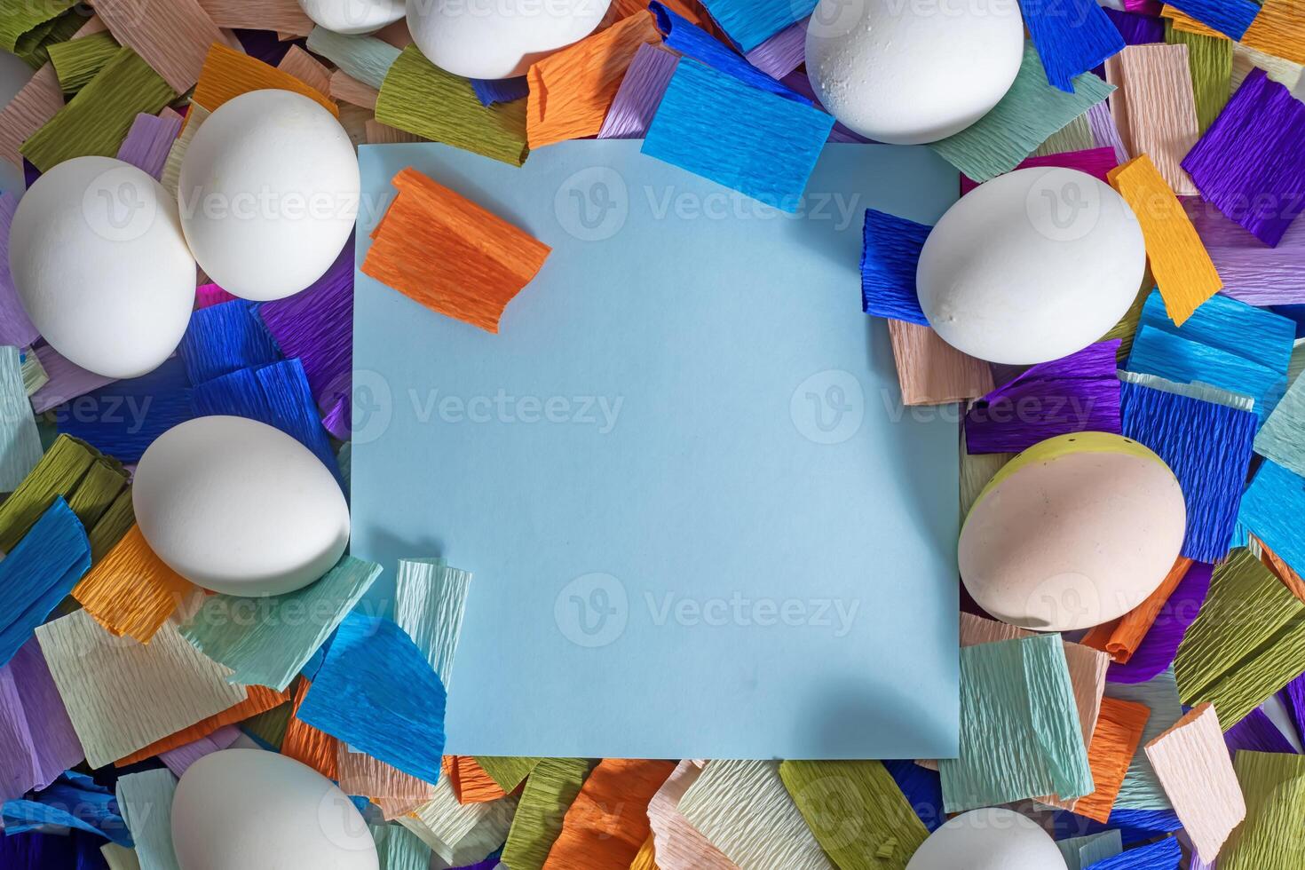 A colorful paper with an empty space surrounded by colorful paper photo