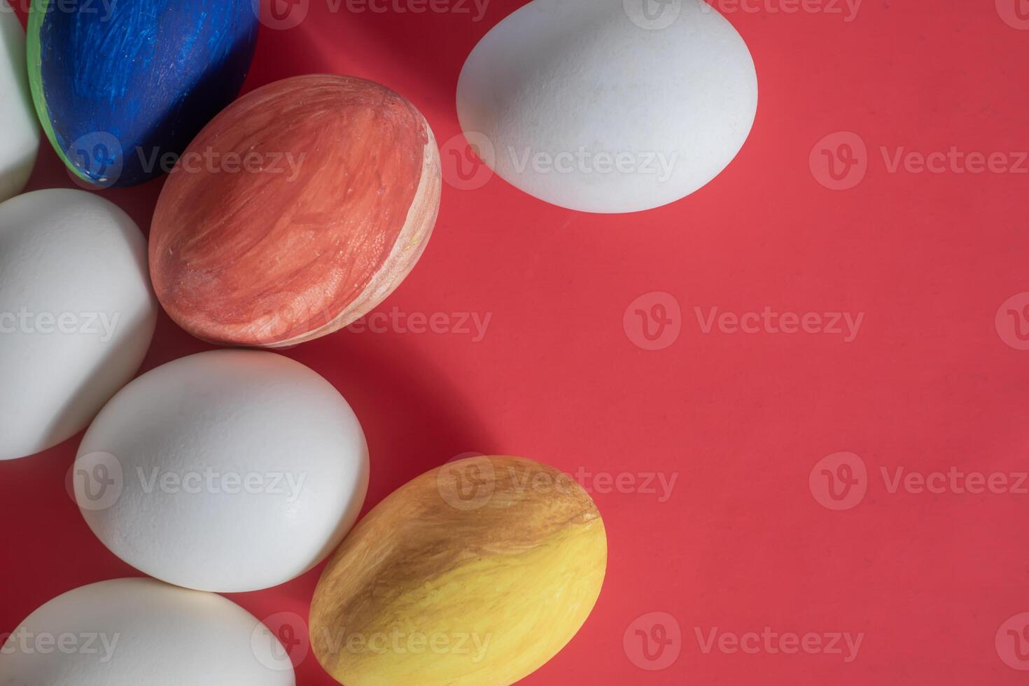 Colorful easter eggs on red background photo
