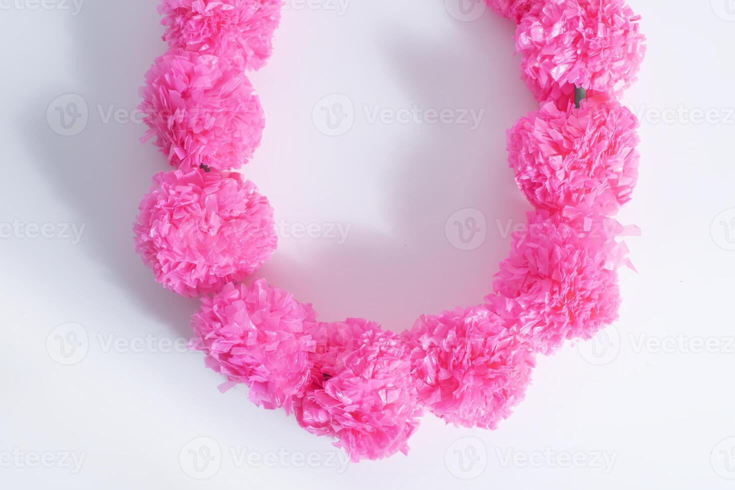 A necklace made out of pink tissue paper photo