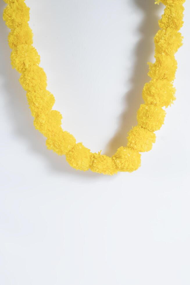 Beautifully decorated bright yellow artificial flower garland photo