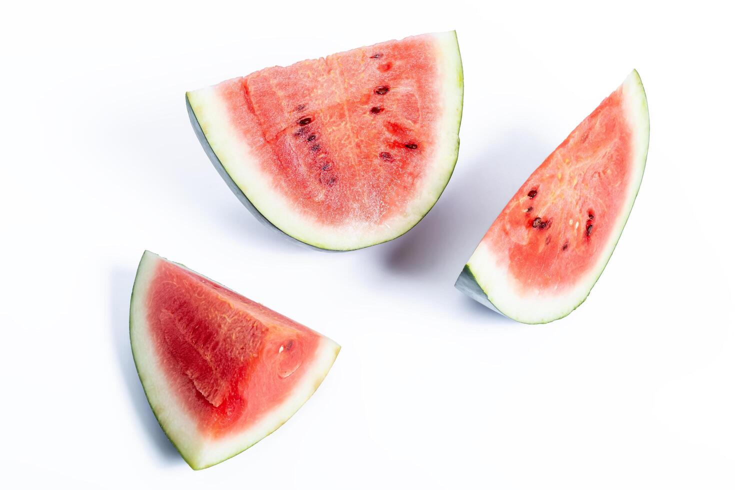 Close-up of fresh red watermelon slices on a white background, healthy eating. photo