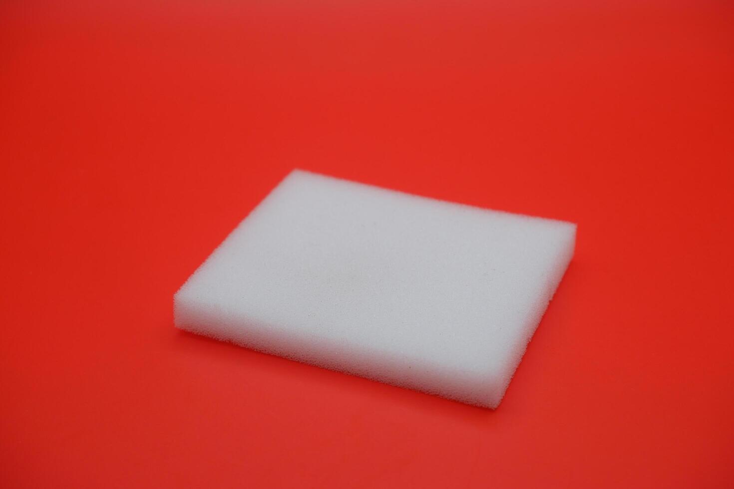 Minimalist Square Foam on Vibrant Red Surface photo