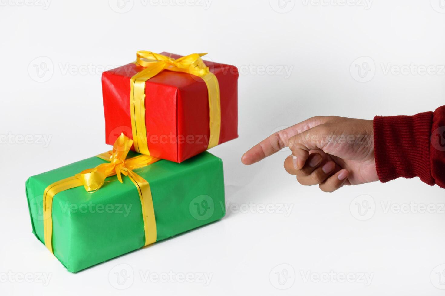 Pointing Finger in a Sweater with Red and Green Accents photo