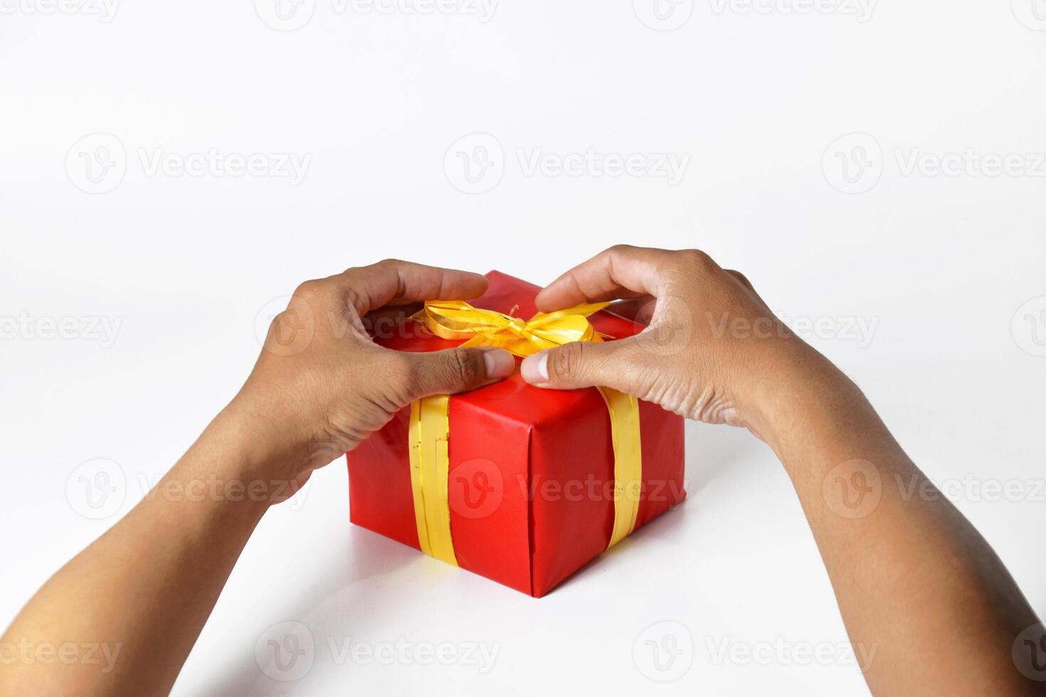Holding a Collection of Red and Green Wrapped Presents photo