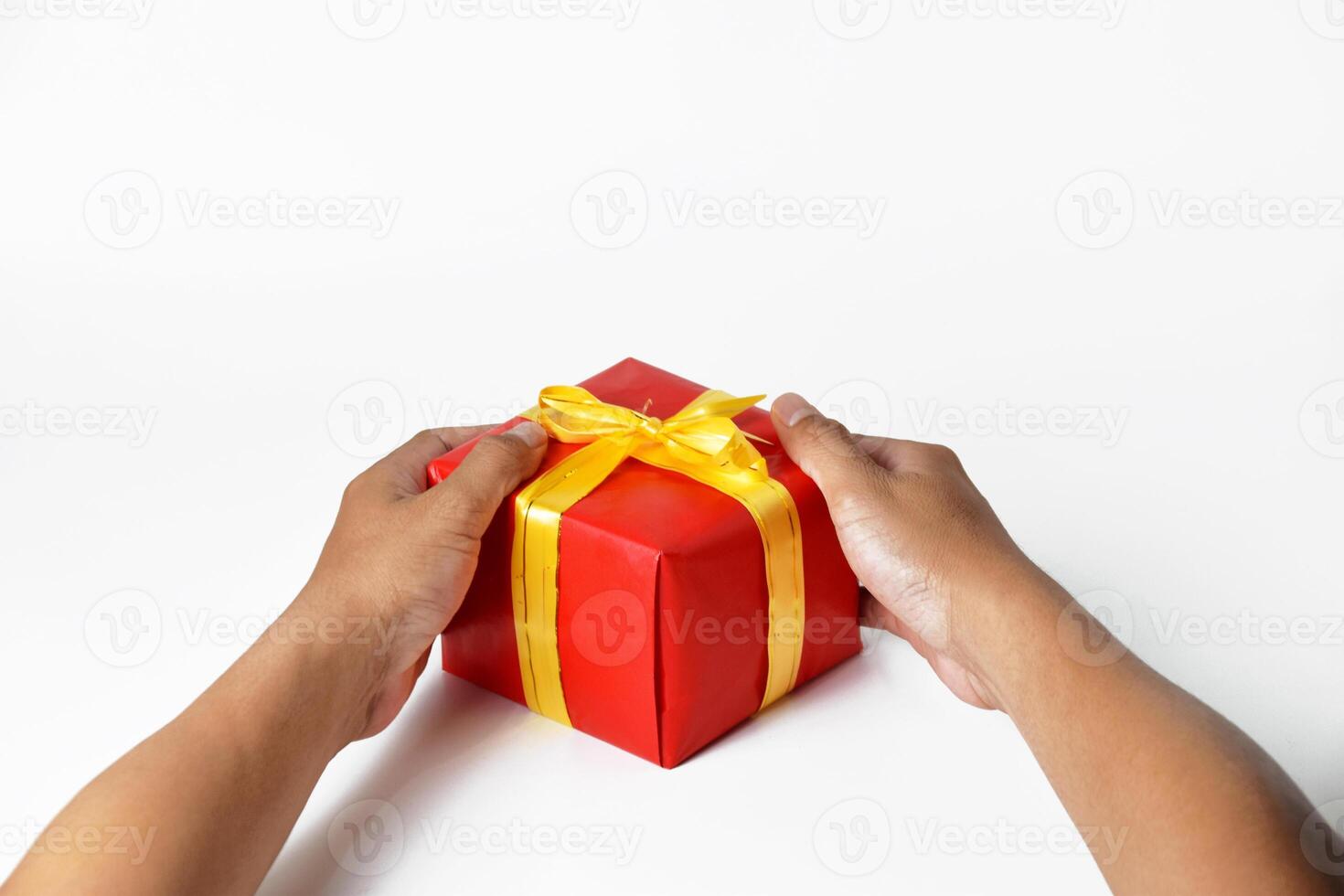 A Mans Hands Holding Multiple Green and Red Gifts photo