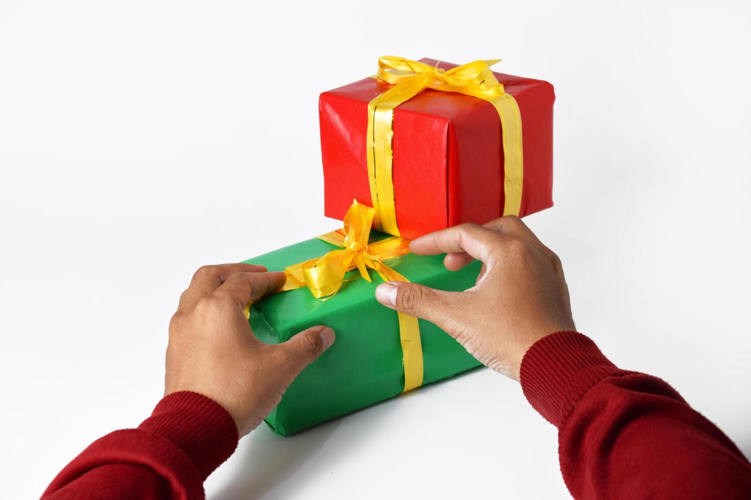 Hands Wrapped in Red Holding Christmas Magic photo