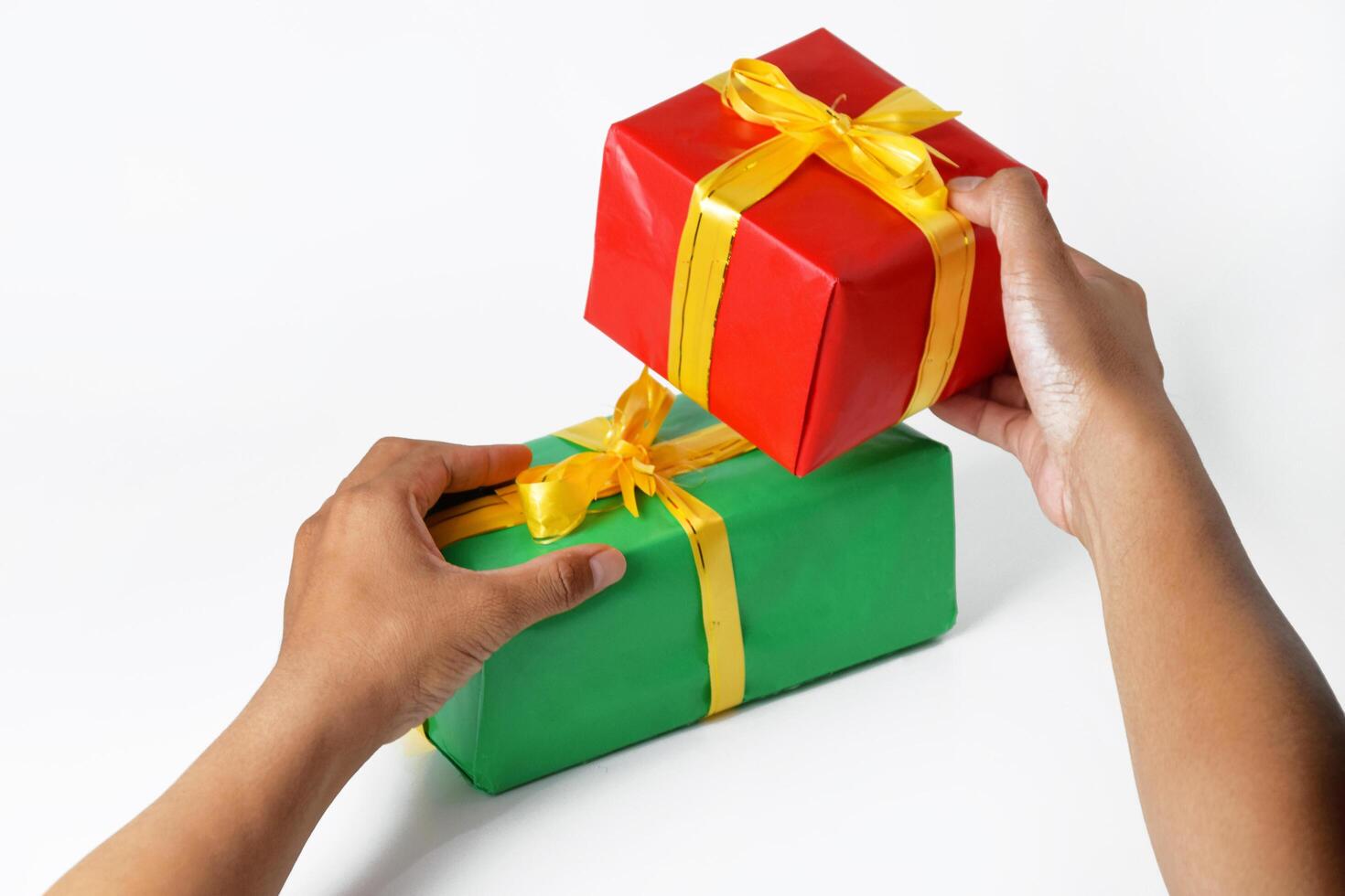 A Mans Hands Presenting Multiple Festive Packages photo