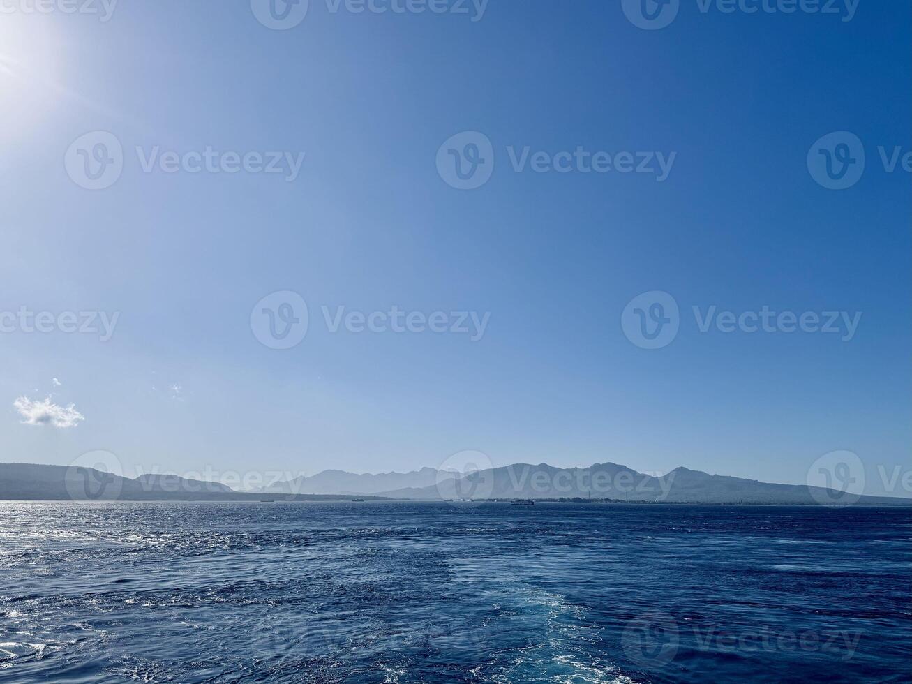 Scenic View of Bali Strait with Deep Blue Ocean and Clear Sky Overlooking the Island of Bali. Serene Seascape, Natural Horizon, Tropical Destination, Travel, Coastal Photography,Landscape photo