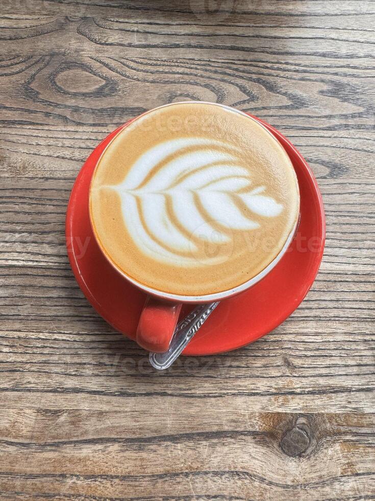 Artistic Latte in a Red Cup photo