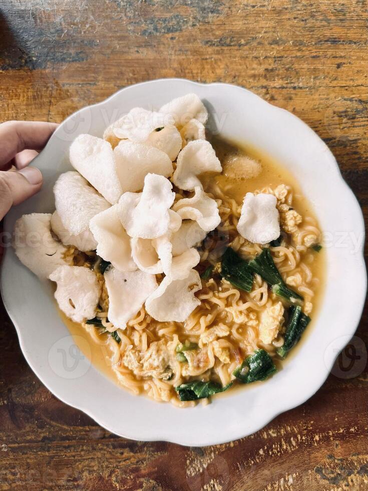 Instant Noodles with Vegetables and Crispy Crackers photo