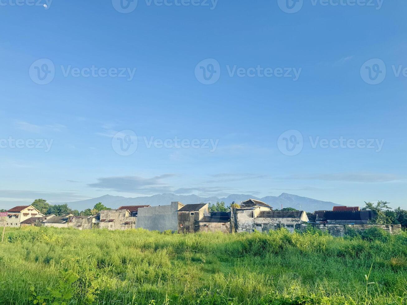 Landscape of Mountain Range and Old Buildings photo