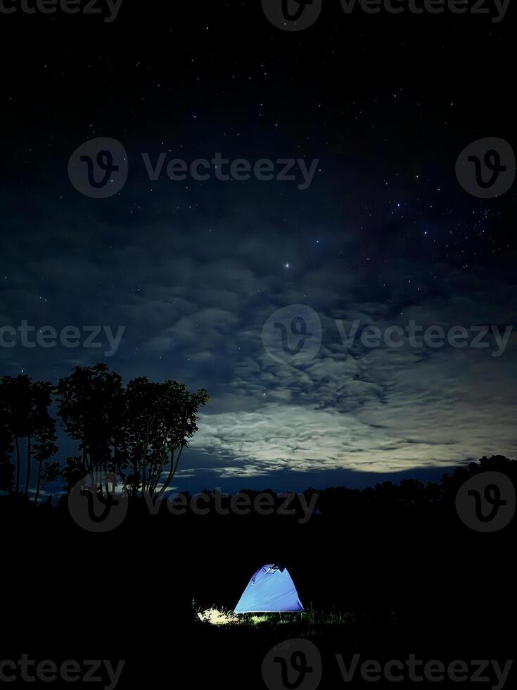 Tent Under Starry Night Sky. Kawah Wurung Ijen Geopark photo