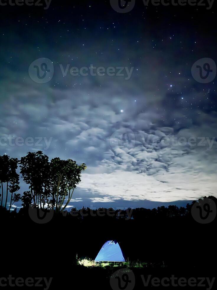 Starry Night Camping with Glowing Tent. Kawah Wurung Ijen Geopark photo