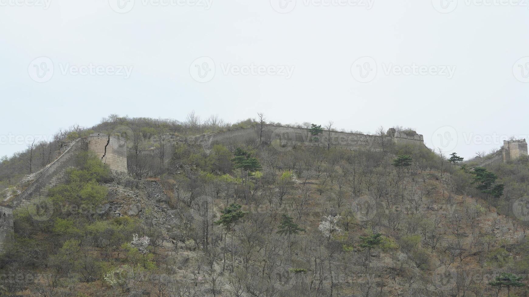The mountains landscape with the broken Great Wall in the early spring photo