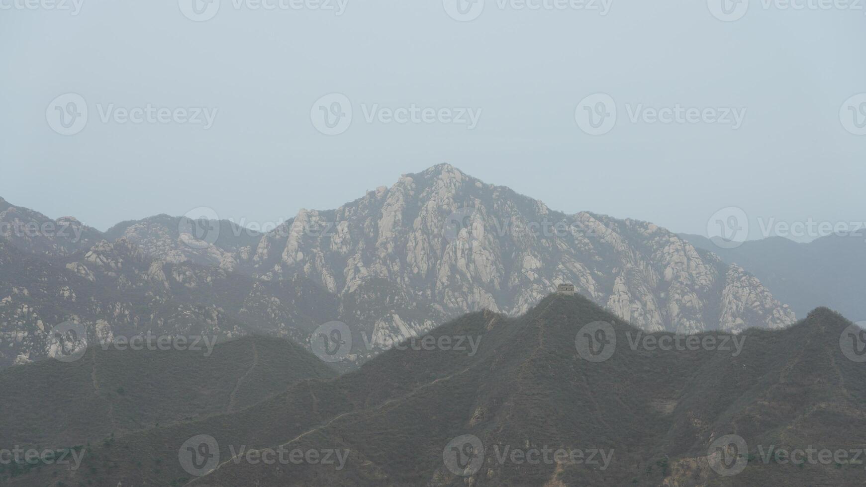 The broken watching tower on the mountains in spring photo
