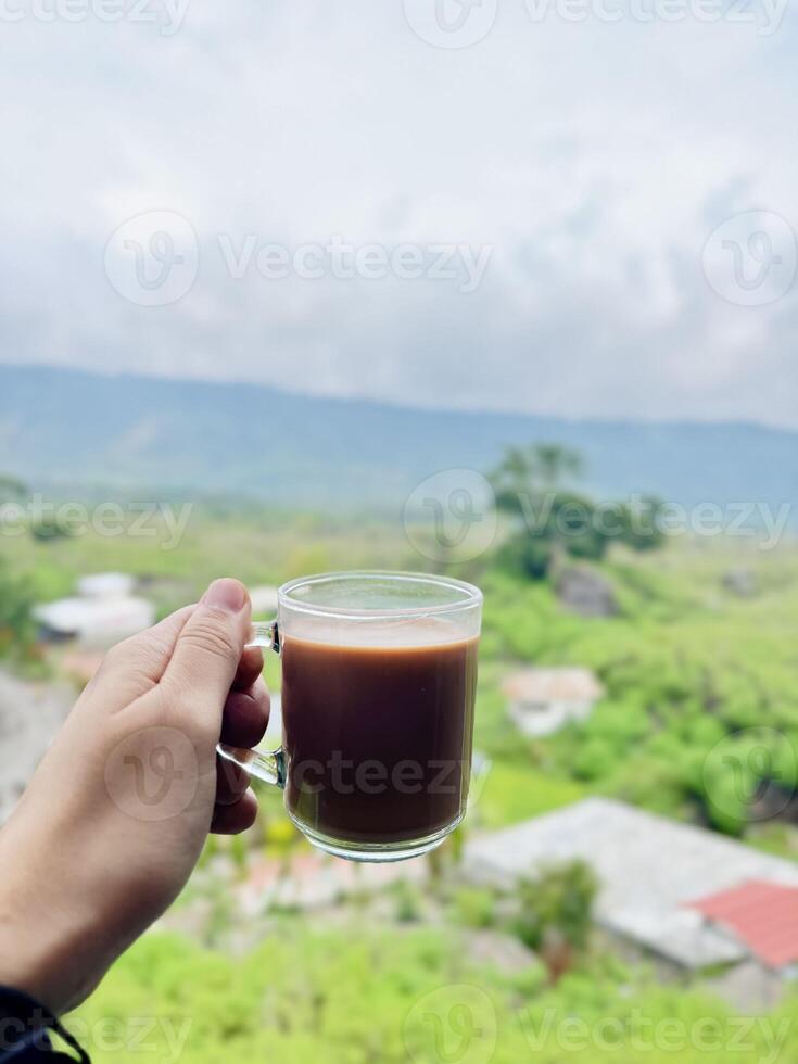 Coffee with a Scenic View of Green Hills photo