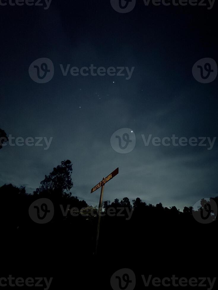 Starry Night Sky with Signpost. Ranu Regulo Semeru Lumajang photo