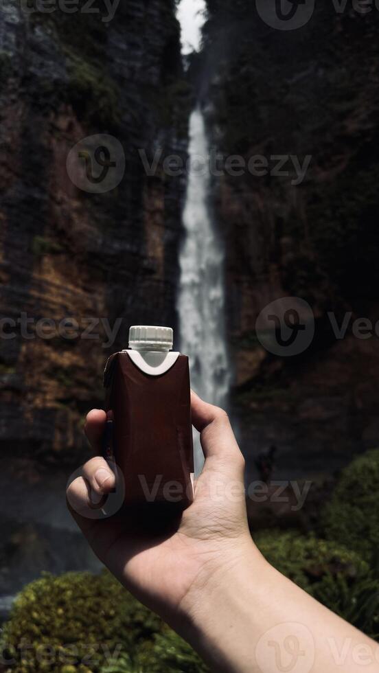 Refreshing Drink by the Waterfall photo