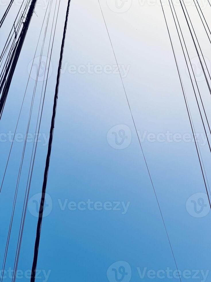 Artistic Minimalist Power Lines Against a Clear Blue Sky photo