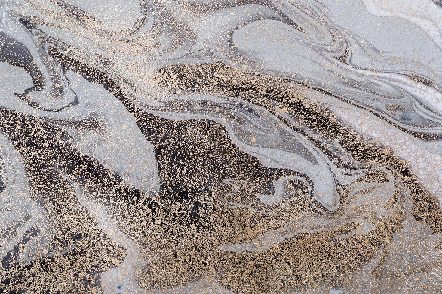 Abstract marble background or texture. Monochrome gray waves and gold particles pattern. Acrylic Fluid Art photo