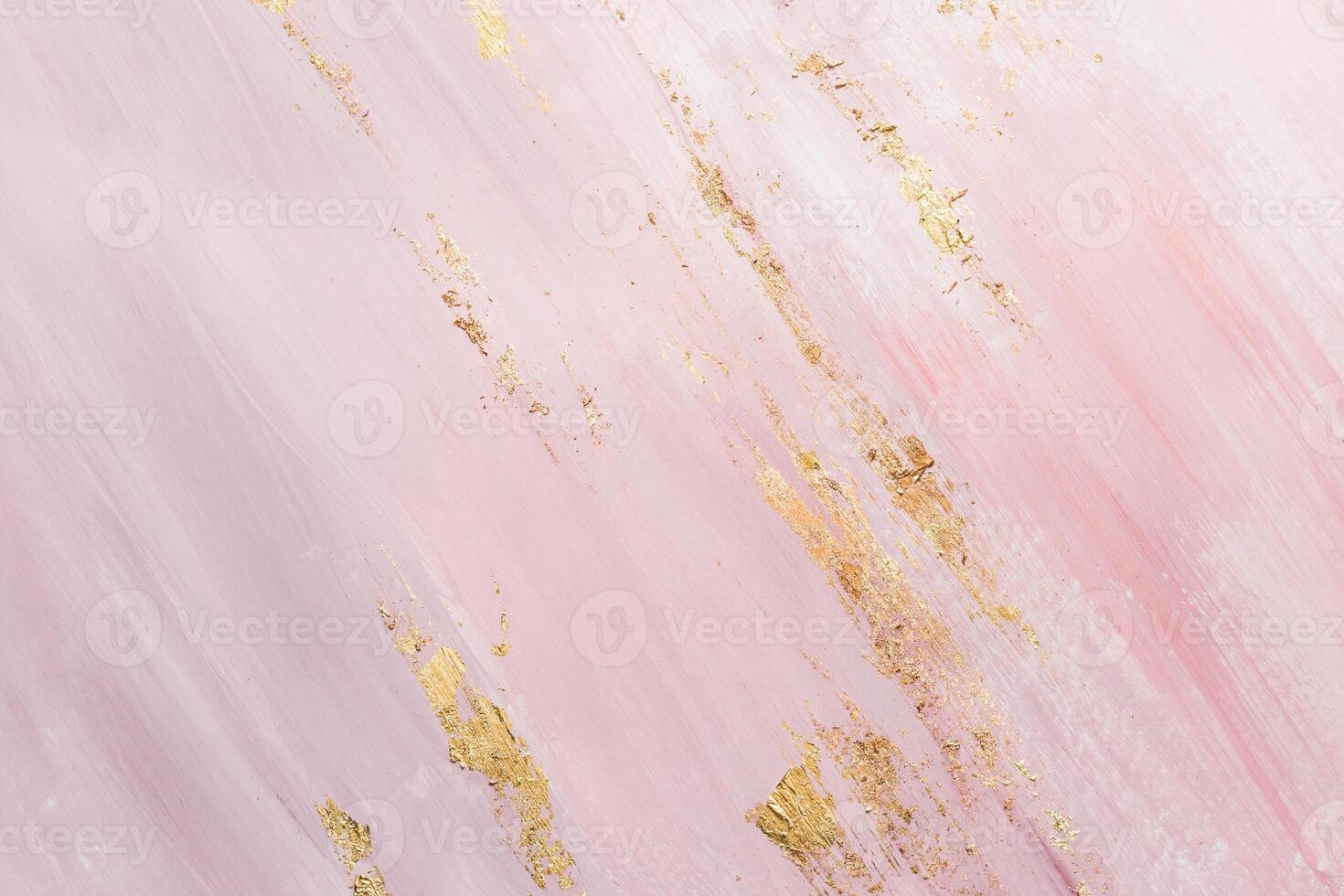 Delicate pink marble background with gold brushstrokes. Place for your design photo
