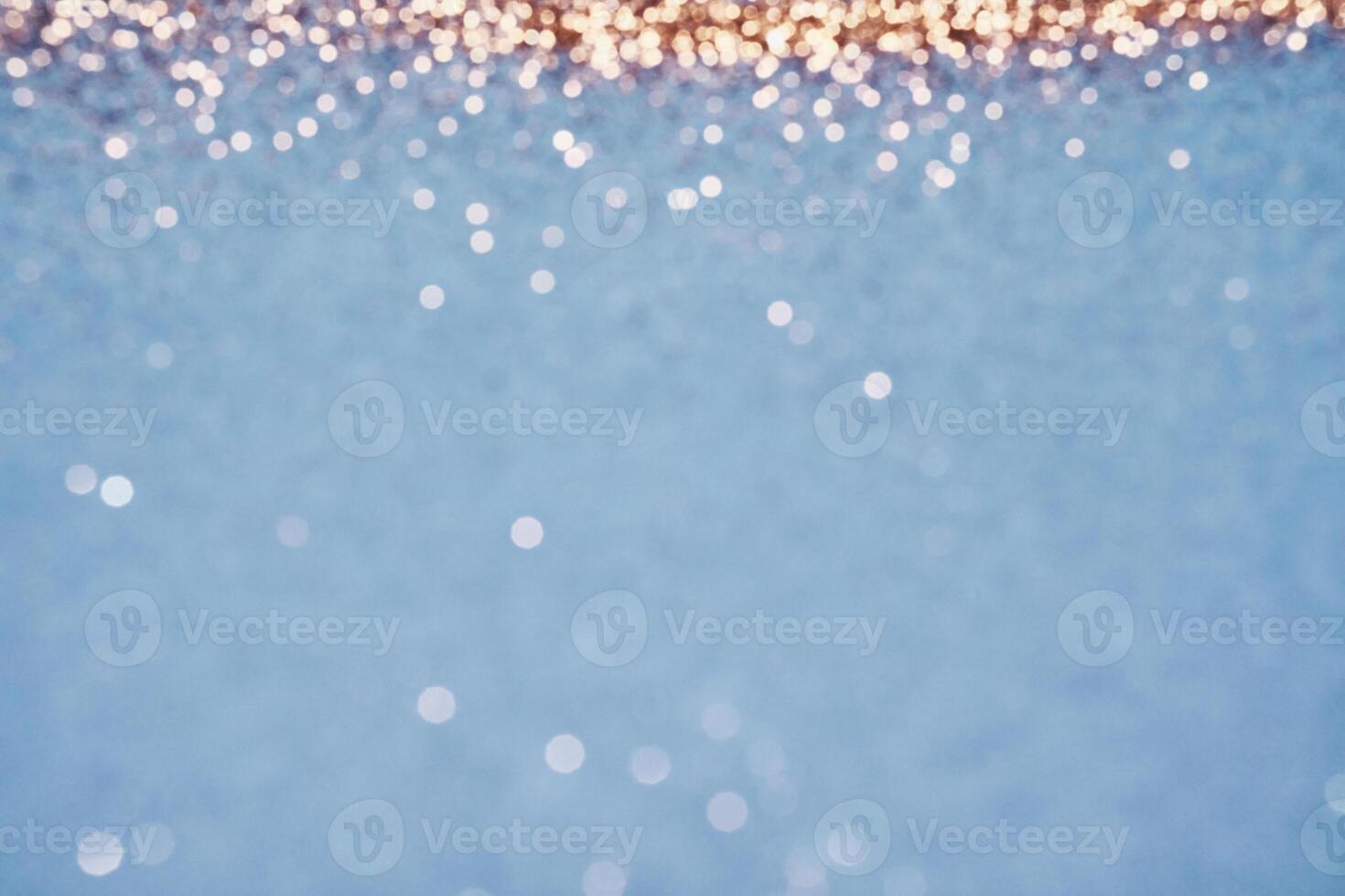 Abstract scattering of gold sparkles. Christmas Winter backdrop, selective focus photo