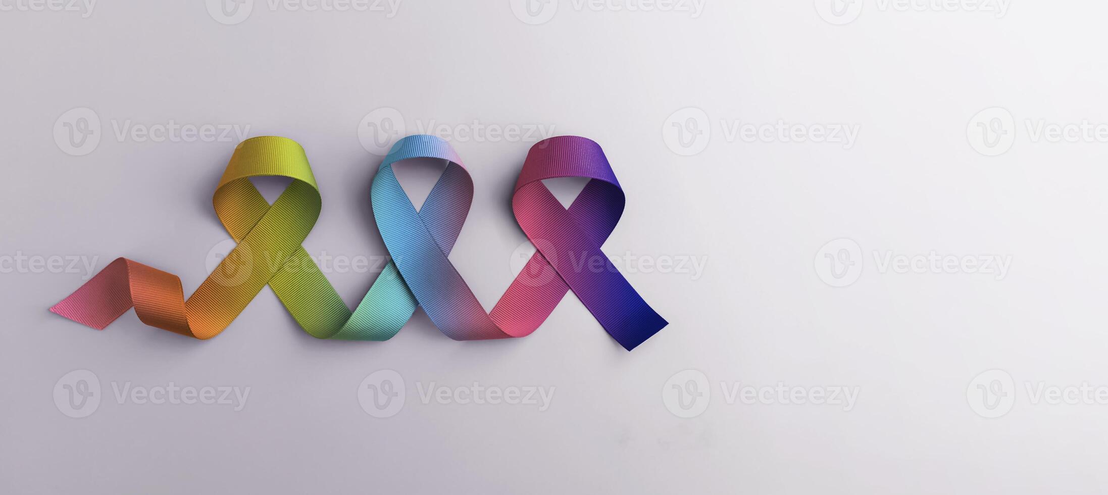 World Autism Day Concepts. Rainbow Color Ribbon on White background. Autism Awareness Day. Neurodiversity, Inclusivity, and Acceptance. Top View photo
