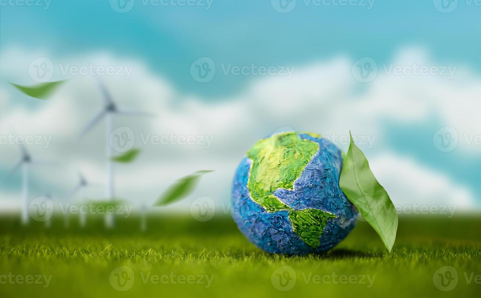 World Earth Day Concept. Green Energy, Renewable and Sustainable Resources. Environmental and Ecology. Green Leaf by the Globe.Blue Sky and Wind Turbine Generator as background photo